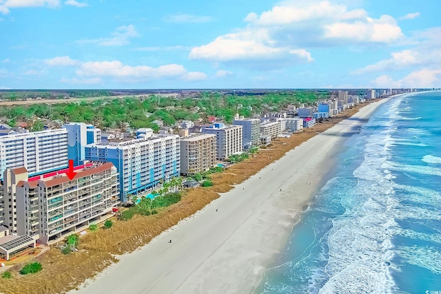 bird's eye view with a city view, a view of the beach, and a water view