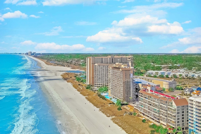 bird's eye view featuring a view of city, a beach view, and a water view