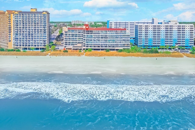 birds eye view of property featuring a view of city and a water view