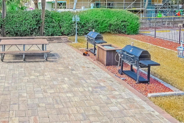 surrounding community with a patio area and fence