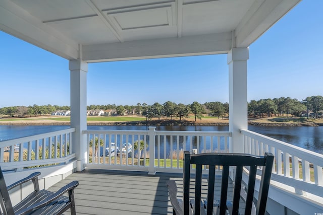 wooden terrace with a water view