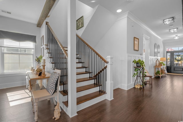 stairs with wood finished floors, visible vents, baseboards, recessed lighting, and crown molding