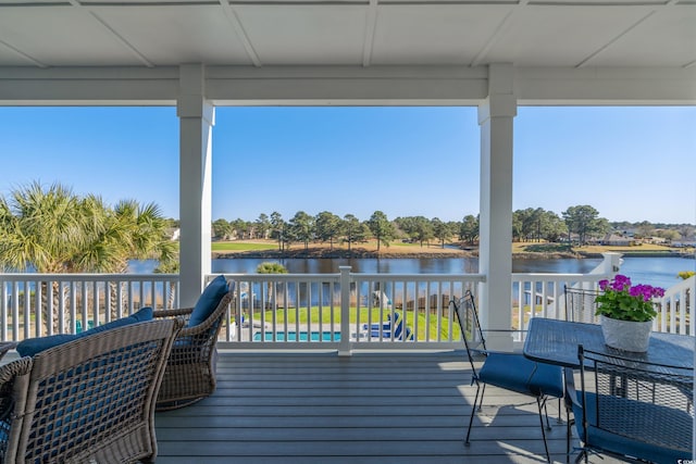 wooden deck featuring a water view