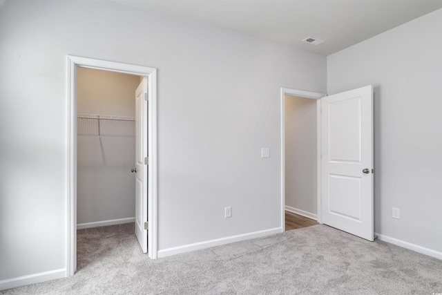 495 Wagner Cir, Conway, SC 29526 - unfurnished bedroom featuring carpet floors, a spacious closet, and a closet