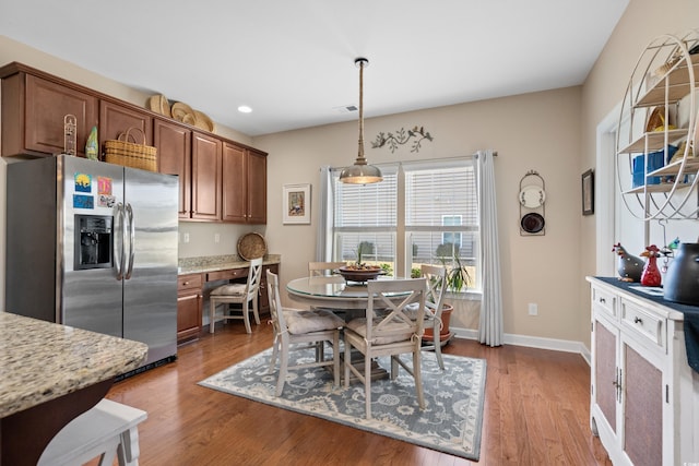 dining space with visible vents, recessed lighting, baseboards, and light wood-type flooring