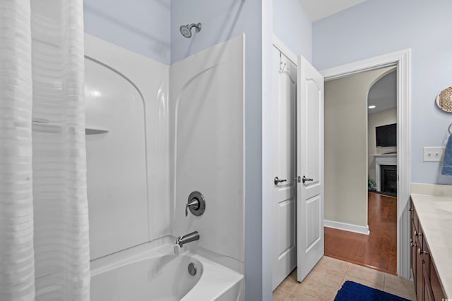 full bathroom with tile patterned flooring, vanity, and shower / bath combination with curtain