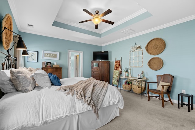 carpeted bedroom featuring a raised ceiling, crown molding, visible vents, and ceiling fan