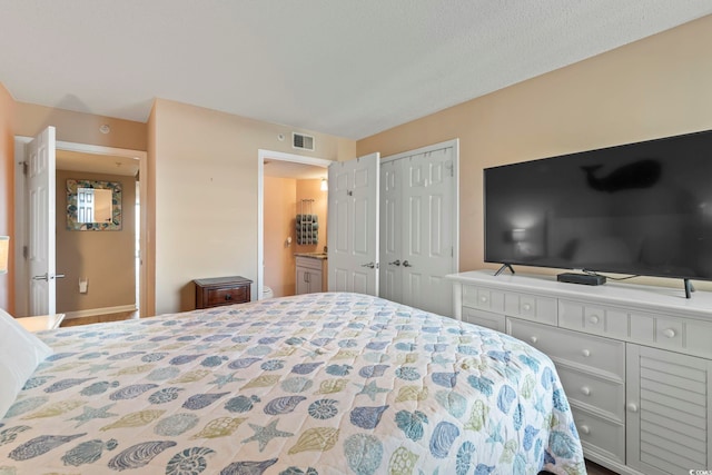 bedroom with a closet and visible vents