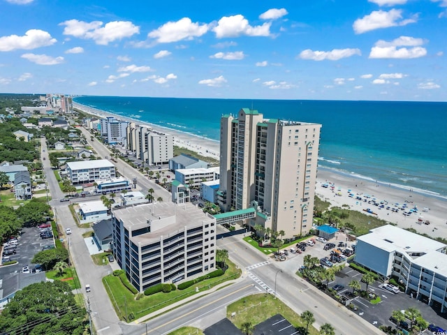 aerial view with a water view, a view of city, and a view of the beach