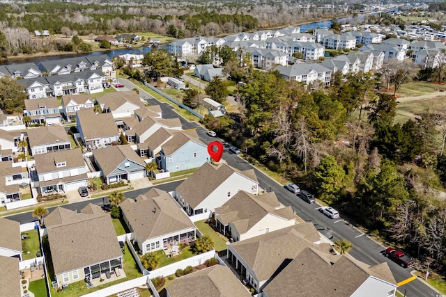 view of property location with nearby suburban area and a nearby body of water