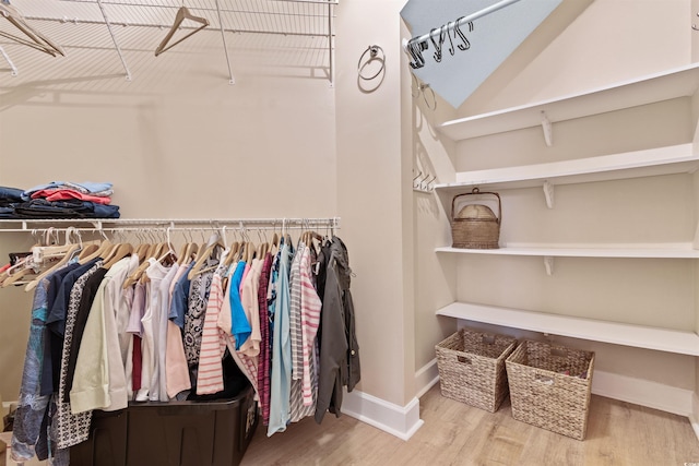 spacious closet featuring wood finished floors