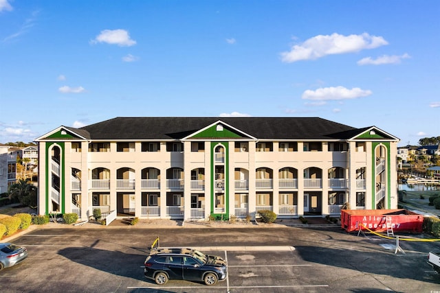 view of property with uncovered parking