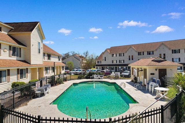 510 Fairwood Lakes Dr Unit 18-P, Myrtle Beach, SC 29588 - community pool with a patio area, fence, and a residential view