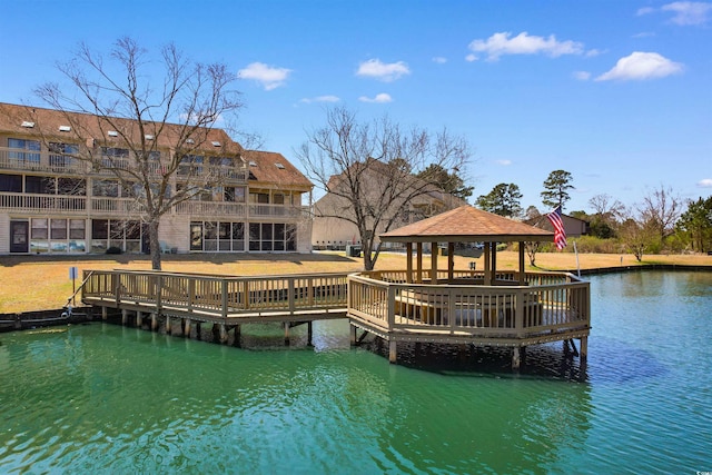 view of dock with a water view and a gazebo