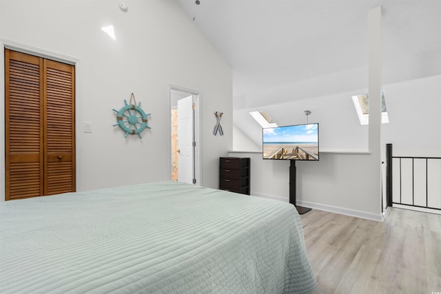 510 Fairwood Lakes Dr Unit 18-P, Myrtle Beach, SC 29588 - bedroom featuring baseboards, a skylight, wood finished floors, and high vaulted ceiling