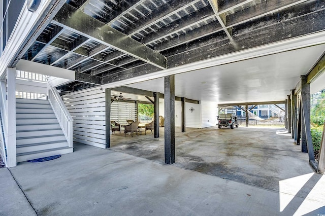 view of patio featuring outdoor dining space and stairway