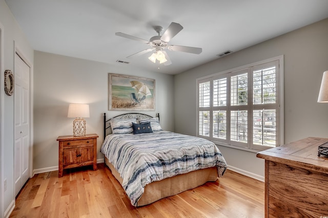 bedroom featuring visible vents, baseboards, and light wood-style flooring