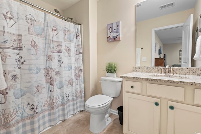 bathroom with vanity, a shower with shower curtain, visible vents, tile patterned flooring, and toilet