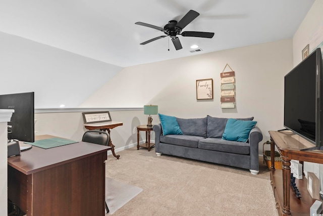 home office with visible vents, light carpet, lofted ceiling, a ceiling fan, and baseboards