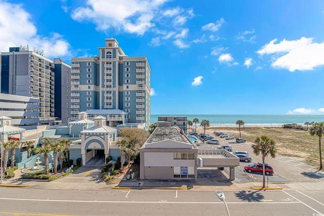 2710 S Ocean Blvd Unit 404, Myrtle Beach, SC 29577 - view of building exterior featuring a water view and uncovered parking
