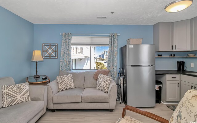 2710 S Ocean Blvd Unit 404, Myrtle Beach, SC 29577 - living room featuring light wood-style flooring and visible vents