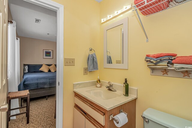 2710 S Ocean Blvd Unit 404, Myrtle Beach, SC 29577 - half bathroom featuring toilet, visible vents, and vanity