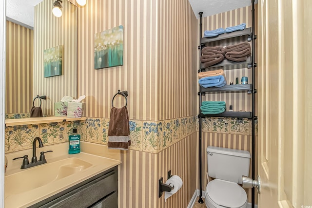 2710 S Ocean Blvd Unit 404, Myrtle Beach, SC 29577 - half bathroom featuring toilet, wallpapered walls, a textured ceiling, and vanity