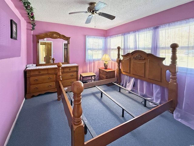 bedroom with baseboards, a textured ceiling, ceiling fan, and carpet flooring