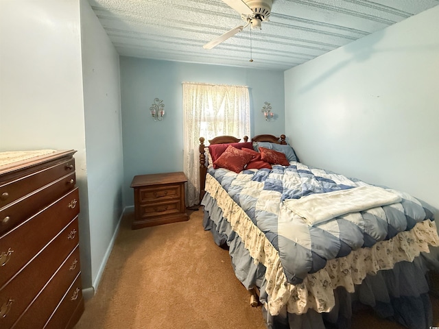 bedroom featuring light carpet and a ceiling fan