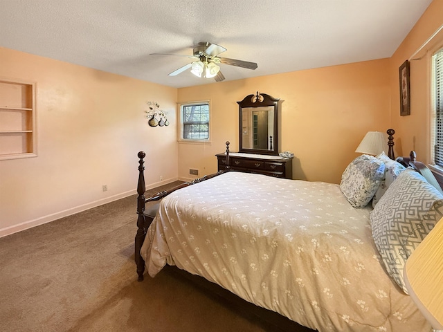 carpeted bedroom with baseboards, a textured ceiling, and ceiling fan