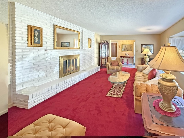 carpeted living area with a brick fireplace and a textured ceiling