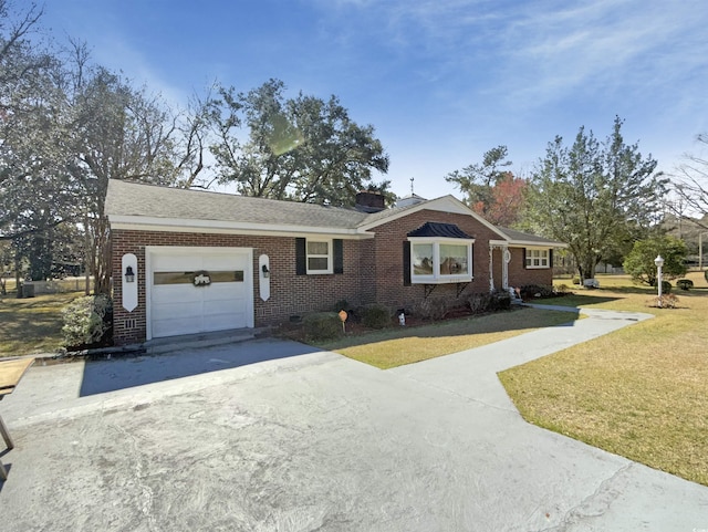 ranch-style house featuring a garage, brick siding, concrete driveway, and a front yard