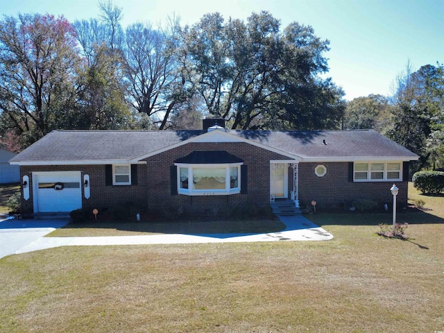 ranch-style house featuring a front yard, entry steps, concrete driveway, a garage, and brick siding