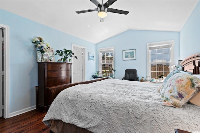 bedroom featuring lofted ceiling, baseboards, dark wood-style flooring, and ceiling fan