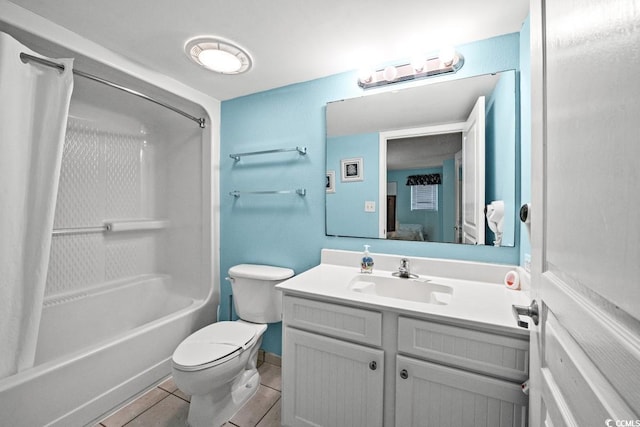 ensuite bathroom featuring vanity, tile patterned floors, toilet, shower / tub combo with curtain, and connected bathroom