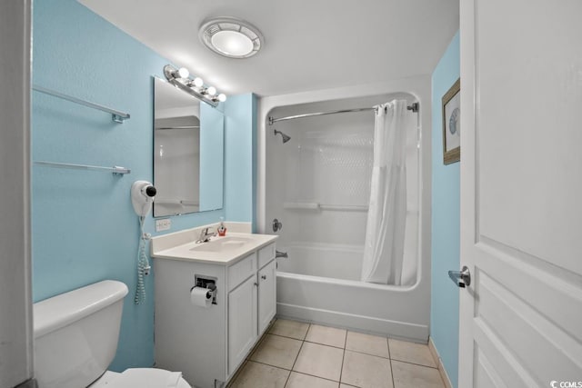 full bathroom with toilet, shower / bath combo, vanity, and tile patterned flooring