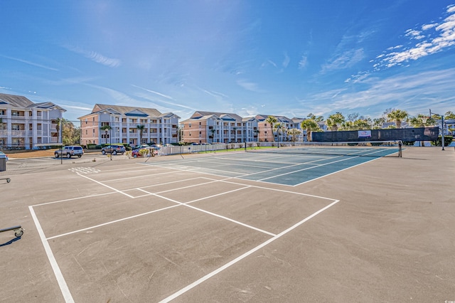 view of tennis court with fence