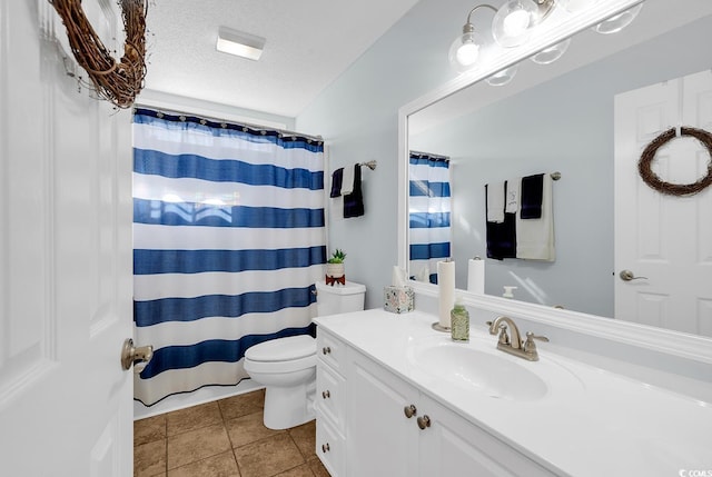 bathroom featuring vanity, tile patterned flooring, a textured ceiling, curtained shower, and toilet