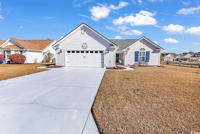 ranch-style house featuring a garage, driveway, and a front yard