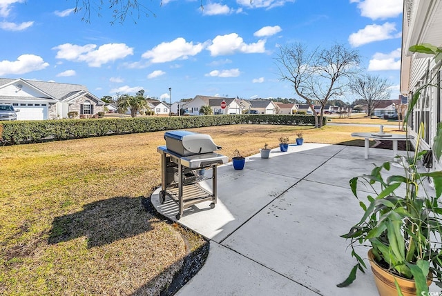 view of home's community with a patio area, a lawn, and a residential view