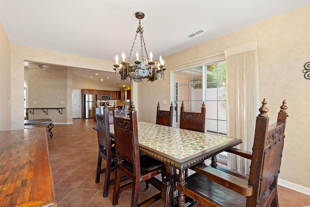 dining room featuring light tile patterned floors, baseboards, visible vents, vaulted ceiling, and a notable chandelier