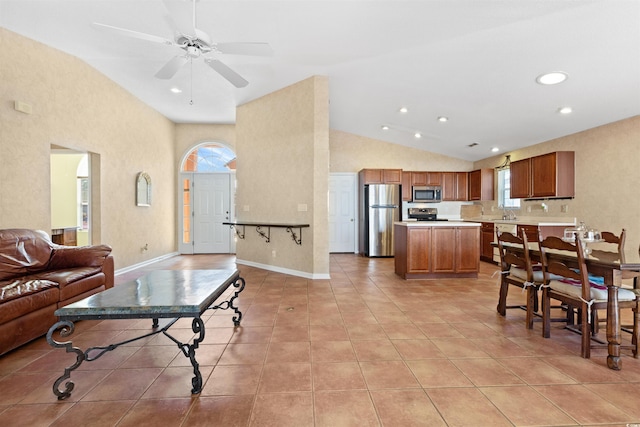 living area featuring high vaulted ceiling, a ceiling fan, recessed lighting, light tile patterned flooring, and baseboards