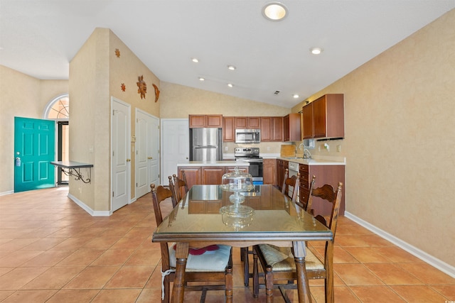 dining room featuring light tile patterned floors, recessed lighting, baseboards, and vaulted ceiling