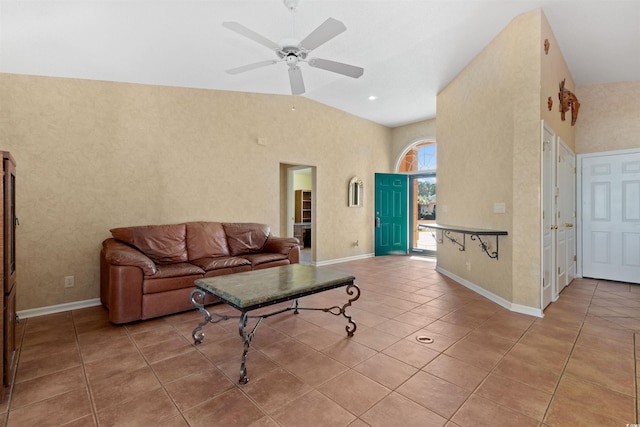 tiled living area with baseboards, a high ceiling, and ceiling fan