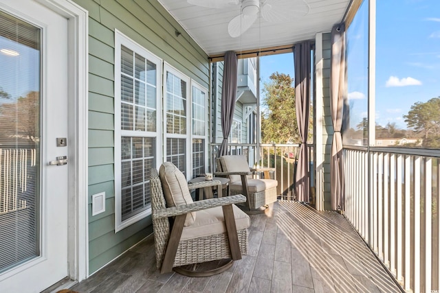 sunroom with a ceiling fan