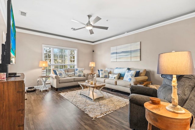 living room with dark wood-style floors, baseboards, visible vents, ceiling fan, and ornamental molding