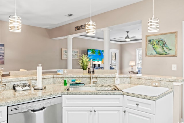 kitchen with visible vents, a ceiling fan, a sink, stainless steel dishwasher, and decorative columns