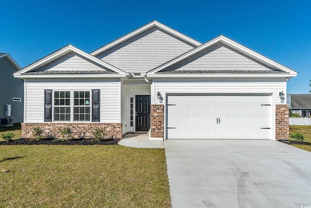 view of front of property featuring a front lawn, a garage, brick siding, and driveway