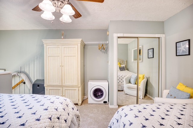 bedroom with a closet, light colored carpet, a ceiling fan, and a textured ceiling