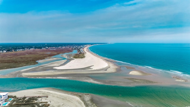 birds eye view of property with a beach view and a water view